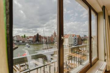 Фото номера Апартаменты с балконом Апартаменты SUITE Szafarnia Prime Location г. Гданьск 12