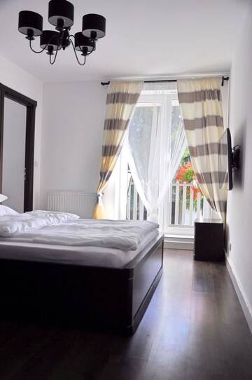 Фото номера Номер с кроватью размера «king-size» и балконом Апартаменты Arenaapartments г. Гданьск 10
