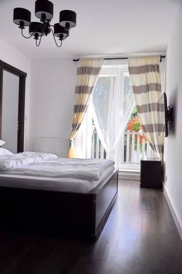 Фото номера Номер с кроватью размера «king-size» и балконом Апартаменты Arenaapartments г. Гданьск 22
